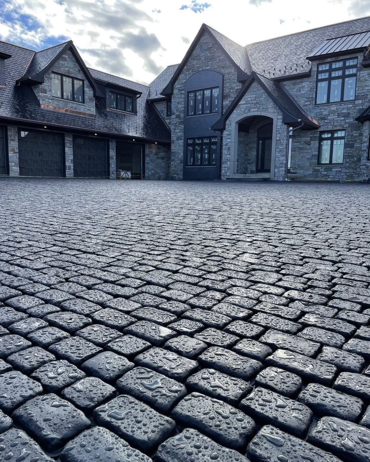 Large luxury home with stone driveway